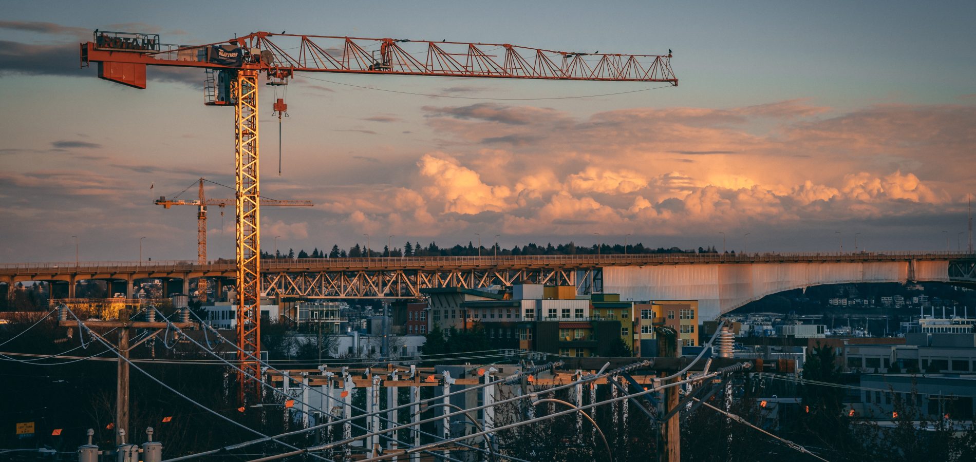 A beautiful view of a construction site in a city during sunset